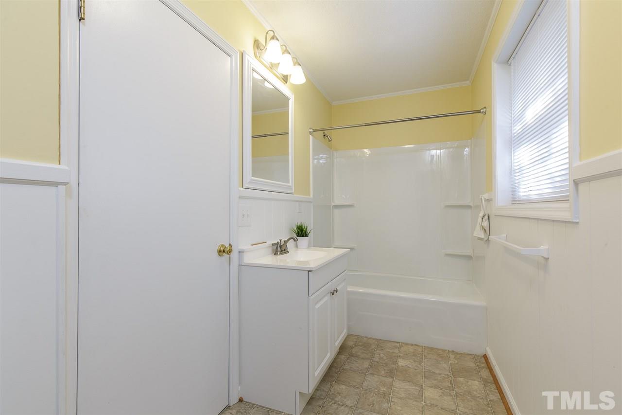 1901 Wellington Road Burlington, NC 27217 - Photo 24 of 24 This full bathroom is on the lower level of the split level floor plan and is accessible to both the separate den and "other" room.