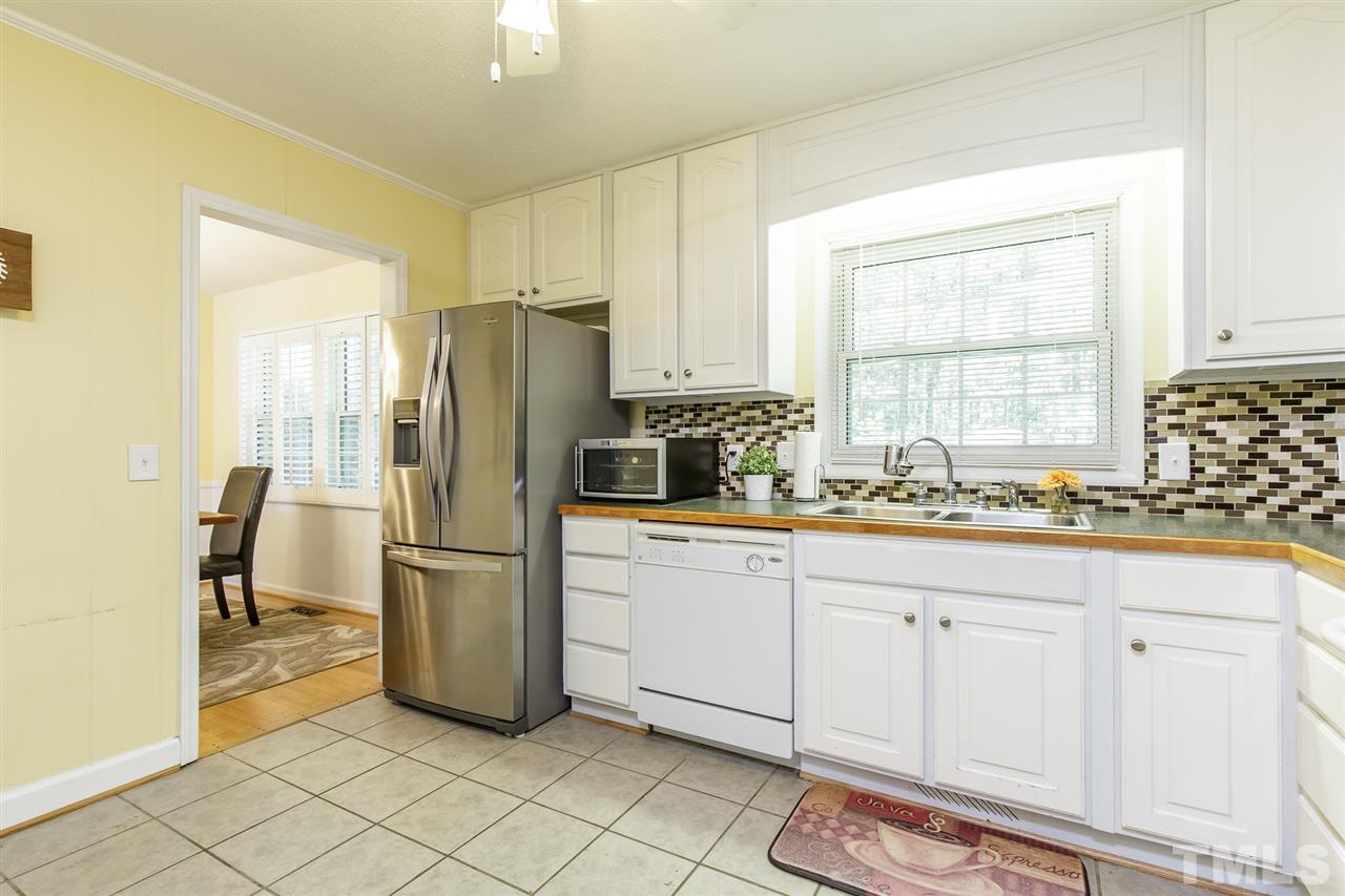 1901 Wellington Road Burlington, NC 27217 - Photo 9 of 24 Newer refrigerator remains with home