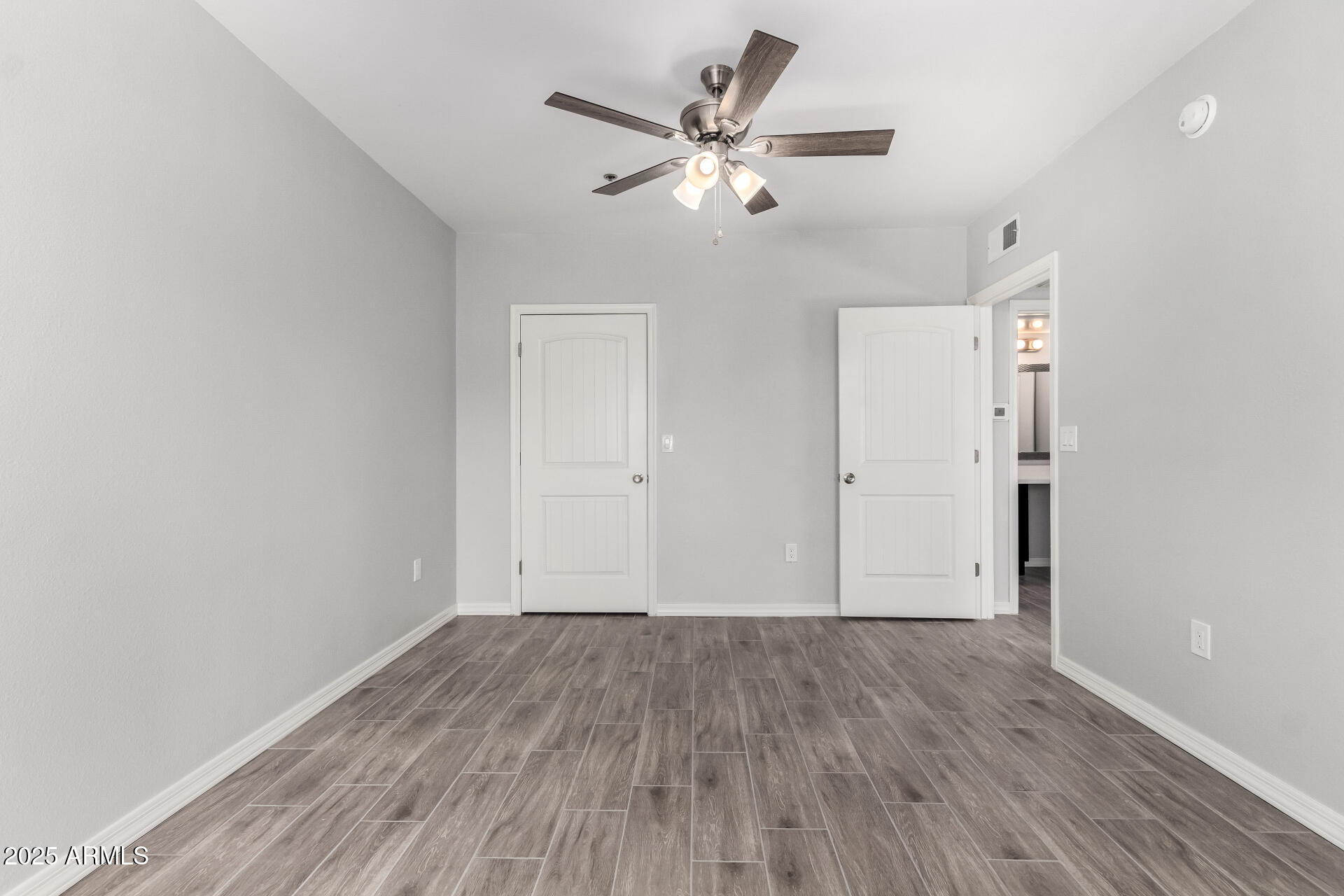 2134 East Broadway Road, Unit 1035 Tempe, AZ 85282 - Photo 20 of 31 wooden floor in an empty room