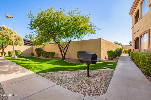 a view of a patio with swimming pool