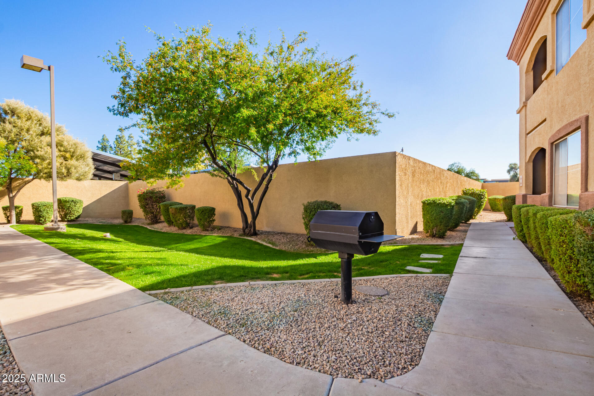 2134 East Broadway Road, Unit 1035 Tempe, AZ 85282 - Photo 27 of 31 a house view with a garden space