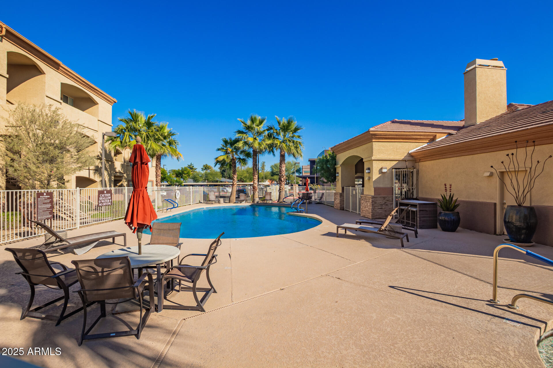 2134 East Broadway Road, Unit 1035 Tempe, AZ 85282 - Photo 28 of 31 a view of a patio with swimming pool