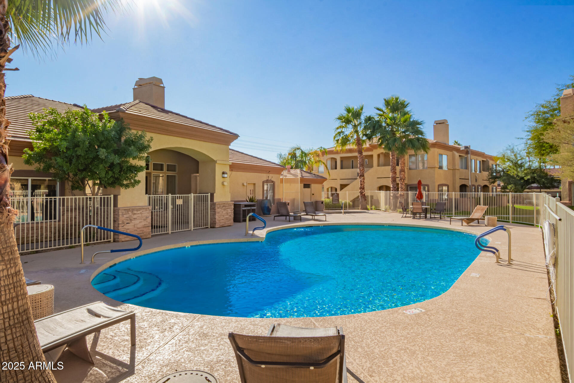 2134 East Broadway Road, Unit 1035 Tempe, AZ 85282 - Photo 31 of 31 a view of a swimming pool with an outdoor seating