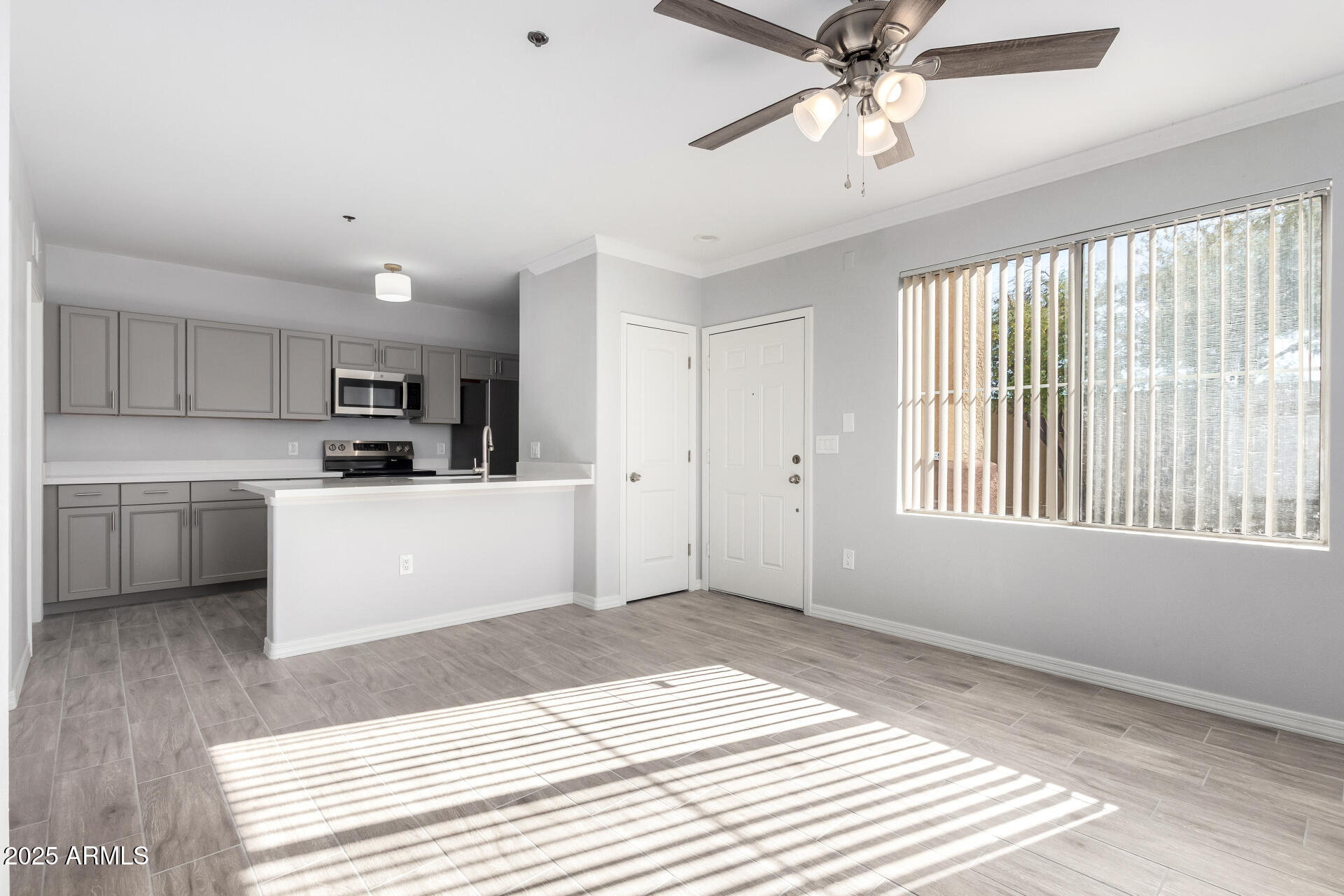 2134 East Broadway Road, Unit 1035 Tempe, AZ 85282 - Photo 6 of 31 a view of a kitchen with a sink cabinets and outdoor space