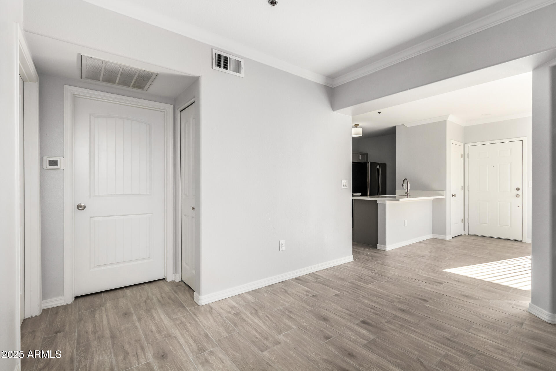 2134 East Broadway Road, Unit 1035 Tempe, AZ 85282 - Photo 10 of 31 a view of a kitchen with wooden floor and a sink
