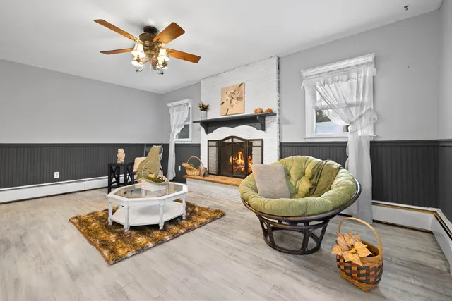 a living room with furniture and a fireplace