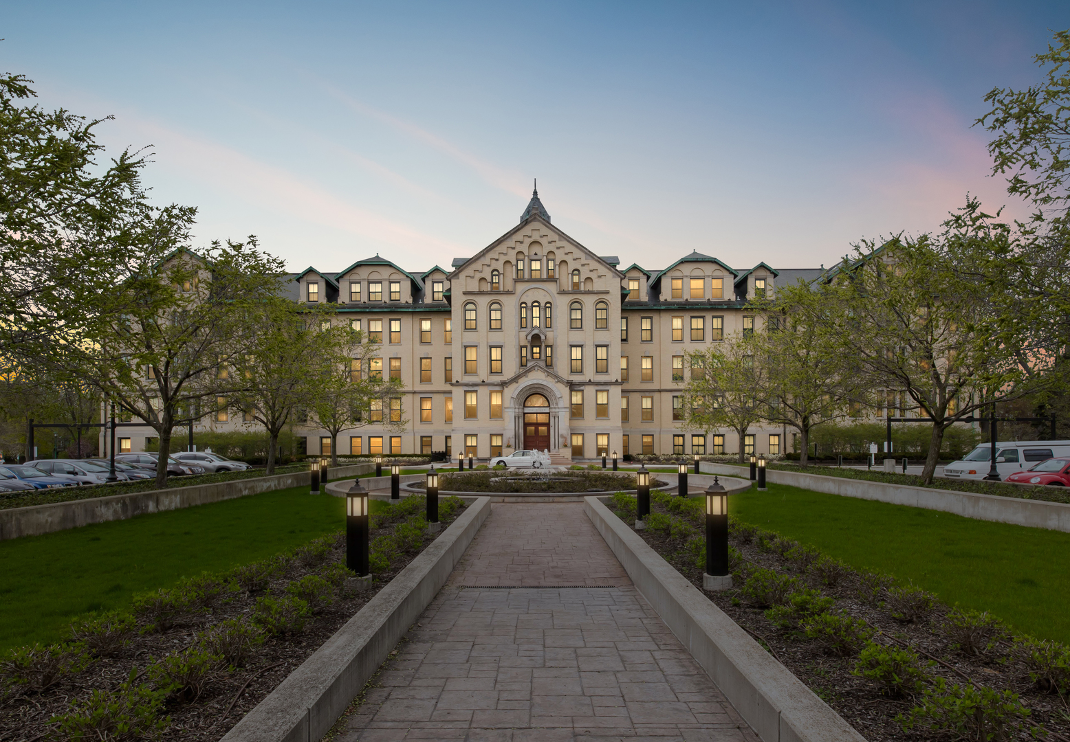 1041 Ridge Road, Unit 304 Wilmette, IL 60091 - Photo 1 of 30 a view of a big building with a big yard and large trees