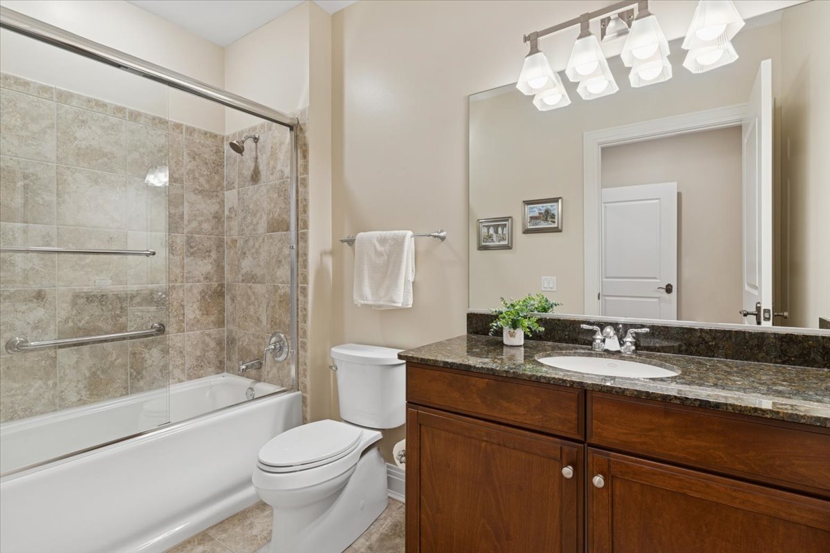 1041 Ridge Road, Unit 304 Wilmette, IL 60091 - Photo 15 of 30 a bathroom with a sink a toilet and shower