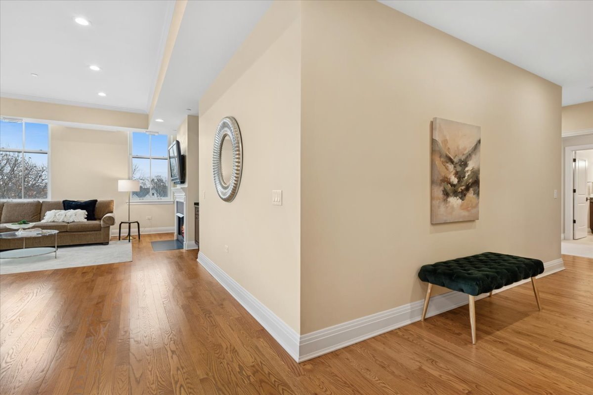 1041 Ridge Road, Unit 304 Wilmette, IL 60091 - Photo 17 of 30 a living room with furniture and a wooden floor