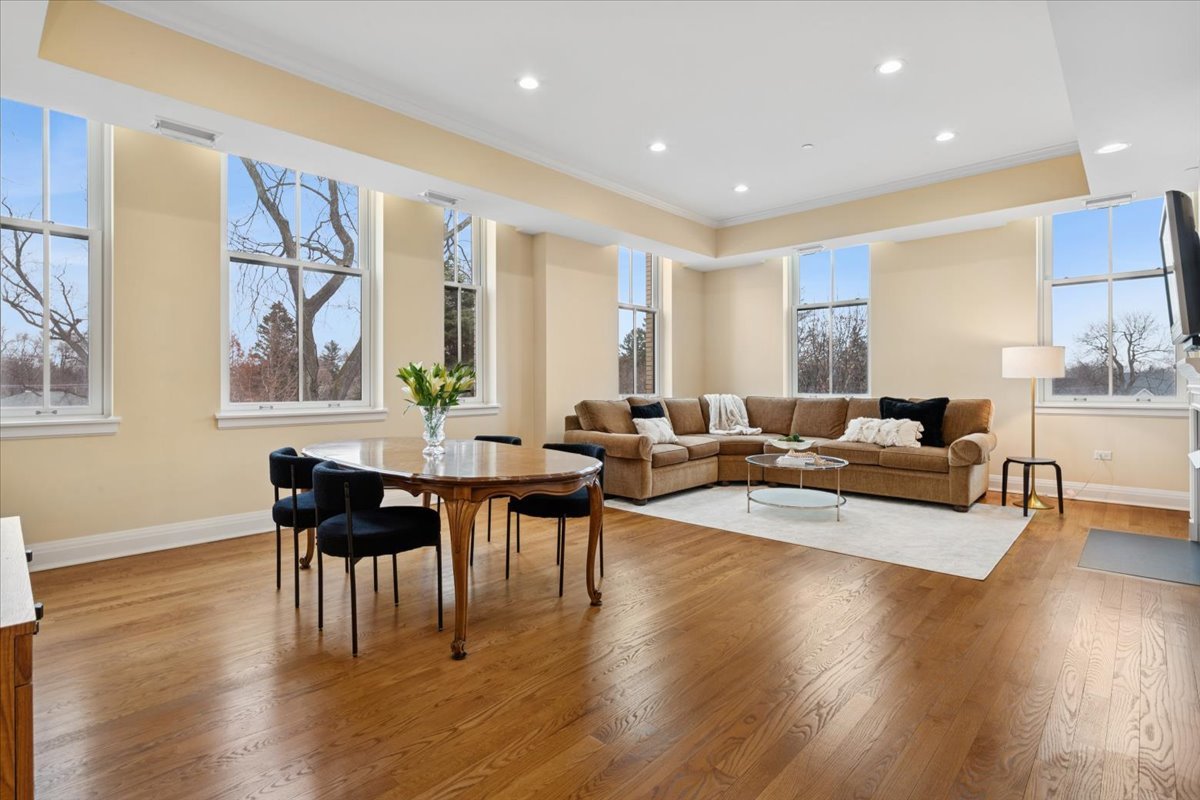 1041 Ridge Road, Unit 304 Wilmette, IL 60091 - Photo 2 of 30 a living room with couches chairs and wooden floor