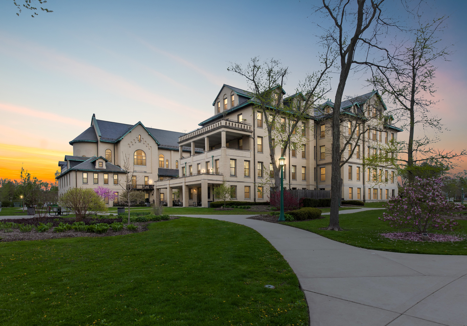 1041 Ridge Road, Unit 304 Wilmette, IL 60091 - Photo 26 of 30 a front view of a house with a garden and trees
