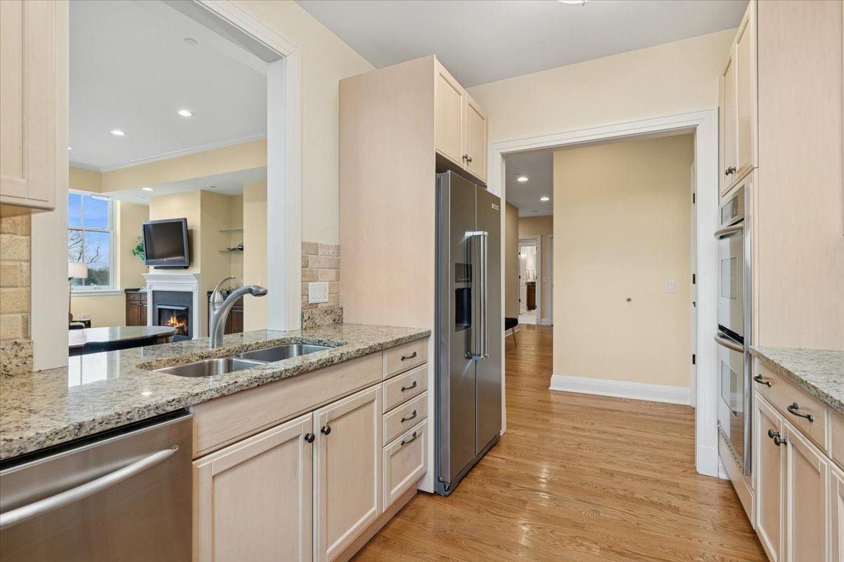 1041 Ridge Road, Unit 304 Wilmette, IL 60091 - Photo 7 of 30 a spacious bathroom with a granite countertop sink mirror and shower