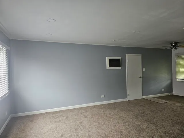 an empty room with windows