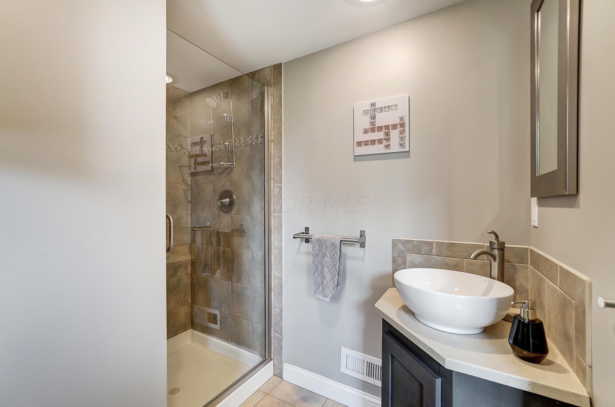 1539 Cardiff Road Columbus, OH 43221 - Photo 19 of 45 The bath has been updated and features a shower and tile floors.