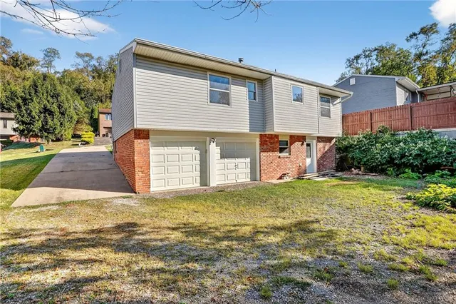 a view of a backyard of the house