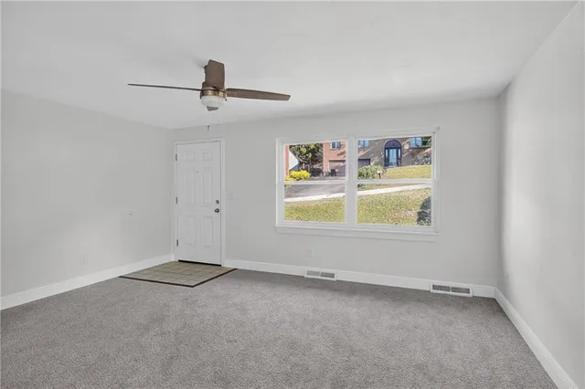 an empty room with windows