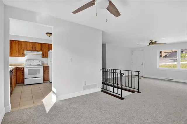 a view of livingroom with furniture and windows