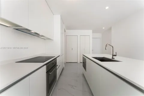a bathroom with a double vanity sink and mirror