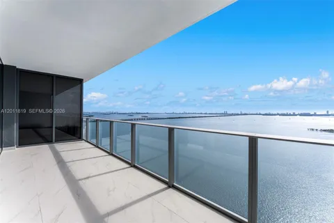 a view of empty room with floor to ceiling window