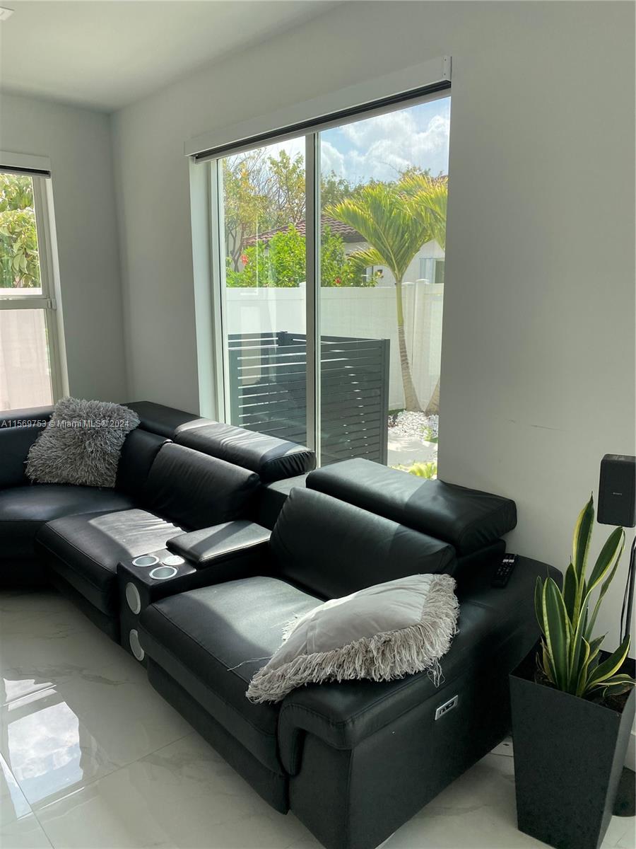 16976 Southwest 90th Terrace Miami, FL 33196 - Photo 12 of 90 a living room with furniture and a potted plant