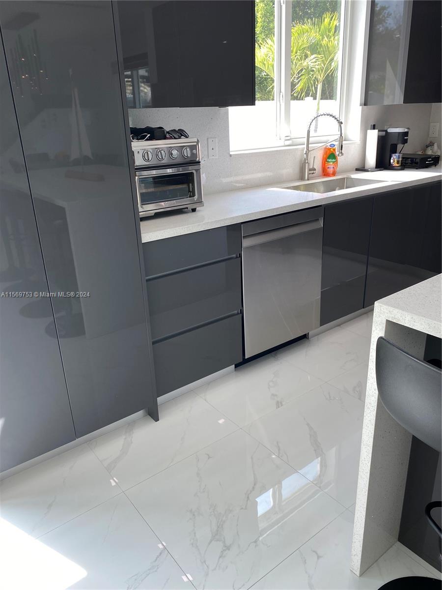 16976 Southwest 90th Terrace Miami, FL 33196 - Photo 13 of 90 a kitchen with a sink and a window