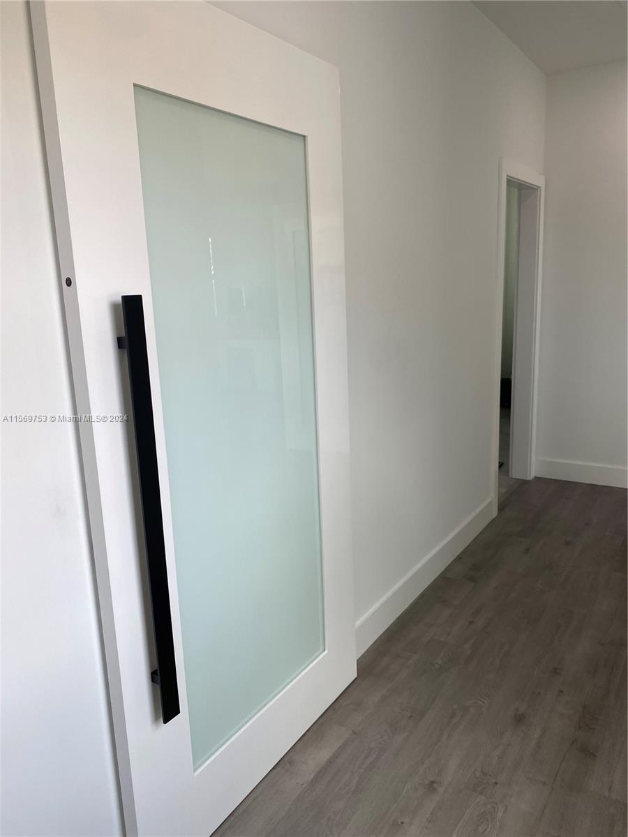 16976 Southwest 90th Terrace Miami, FL 33196 - Photo 59 of 90 an empty room with mirror