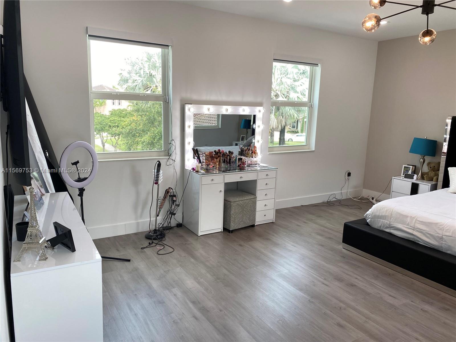 16976 Southwest 90th Terrace Miami, FL 33196 - Photo 62 of 90 a bedroom with bed and a large window