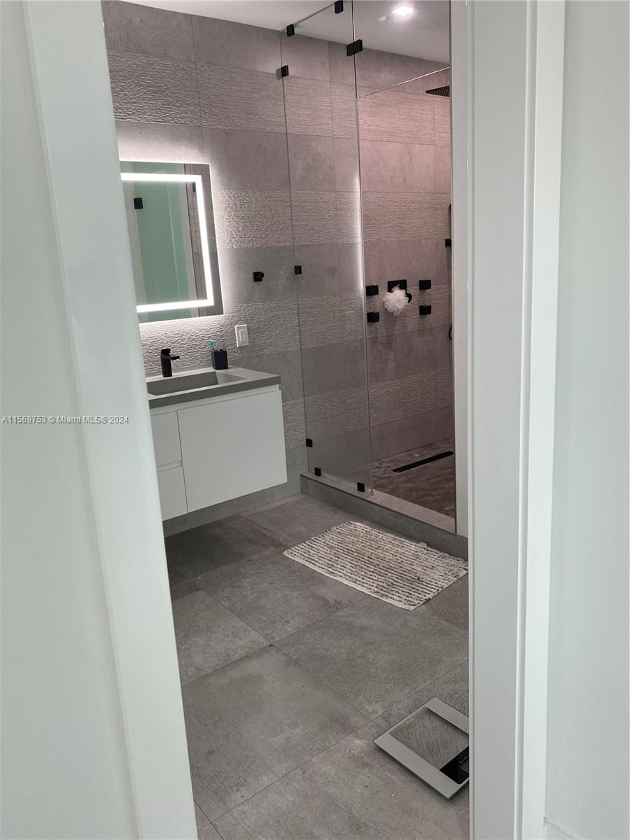 16976 Southwest 90th Terrace Miami, FL 33196 - Photo 66 of 90 a bathroom with a sink a toilet and shower