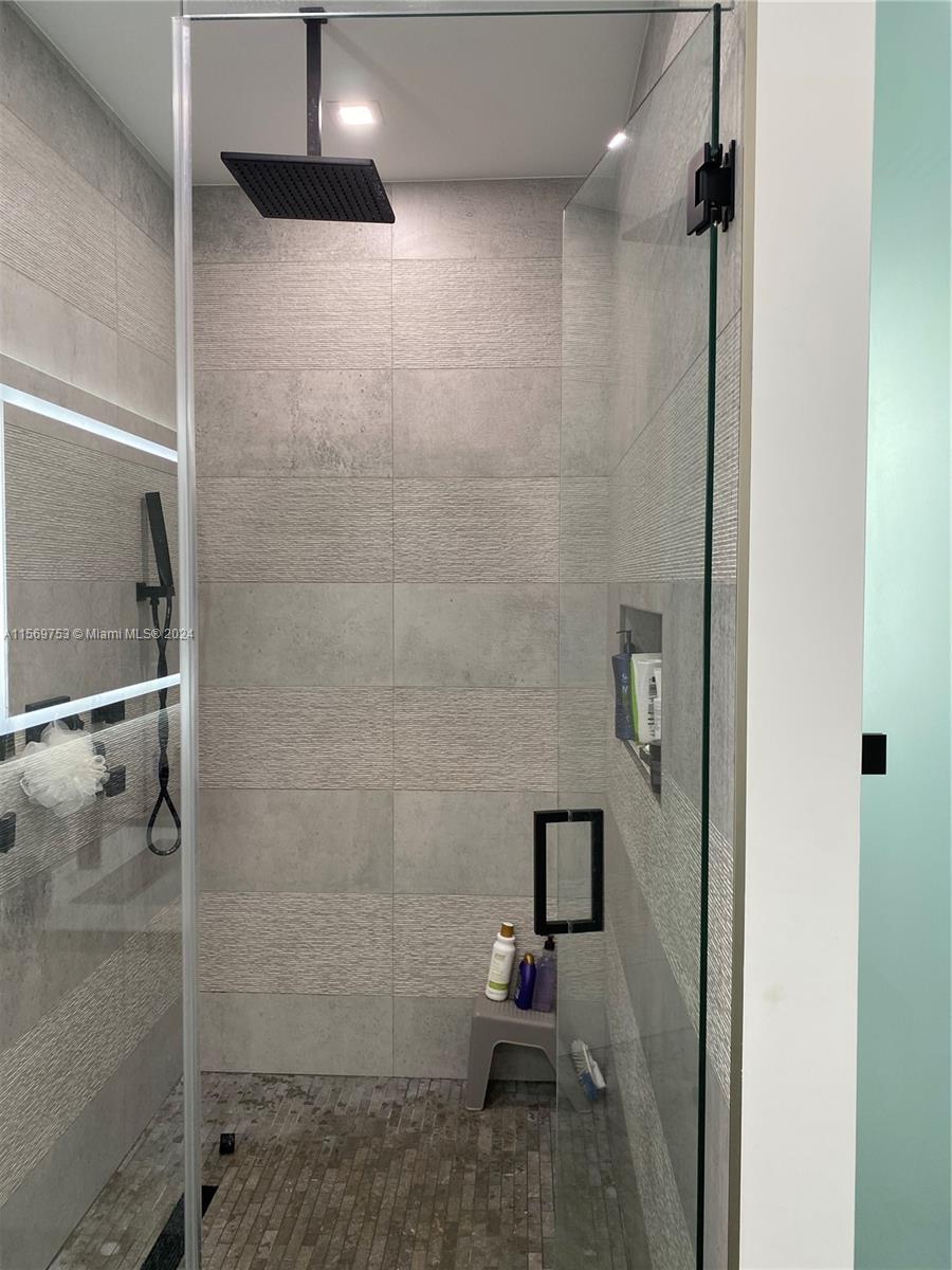 16976 Southwest 90th Terrace Miami, FL 33196 - Photo 69 of 90 a bathroom with a toilet and a shower