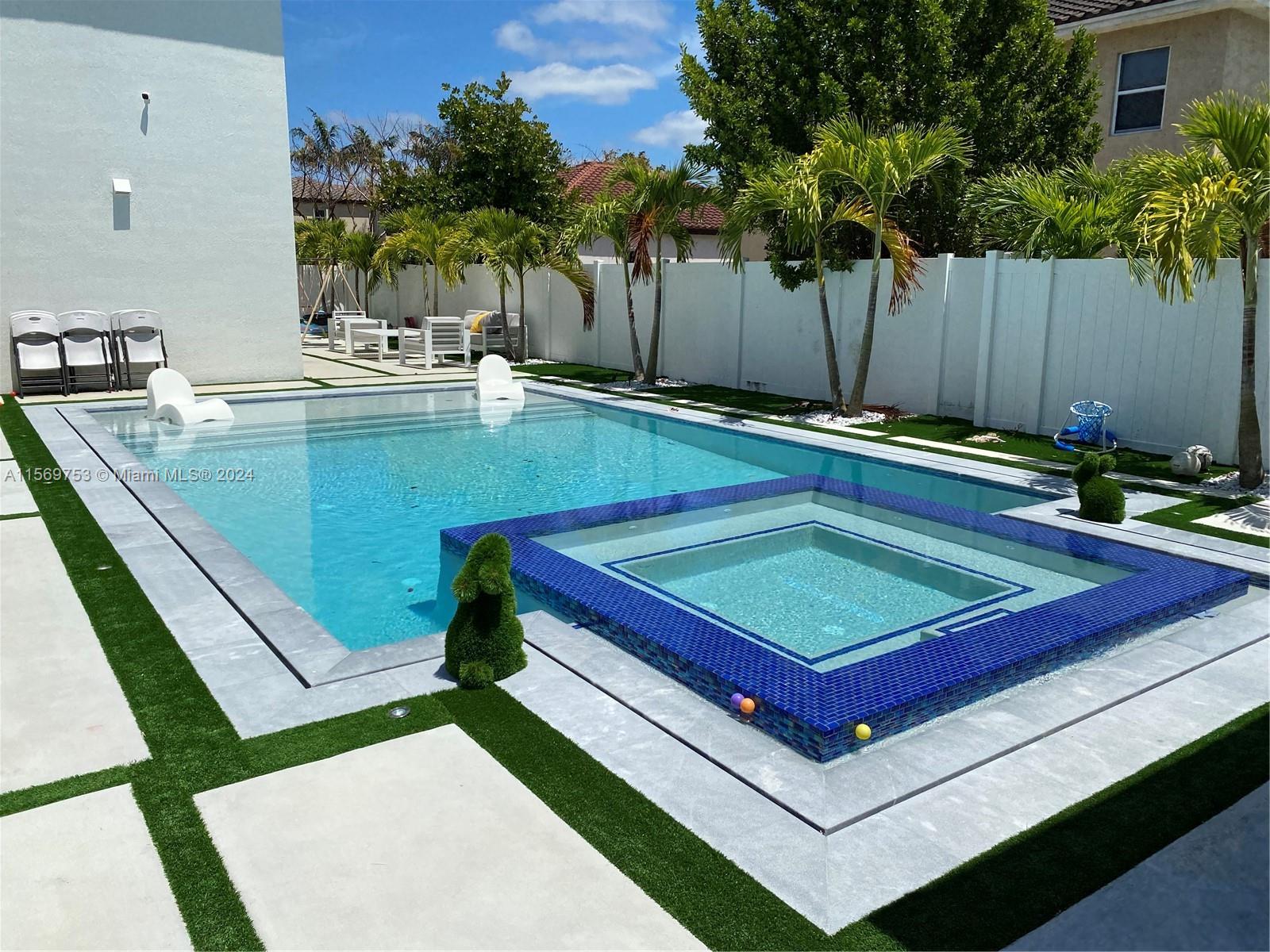 16976 Southwest 90th Terrace Miami, FL 33196 - Photo 81 of 90 a view of a pool with chairs