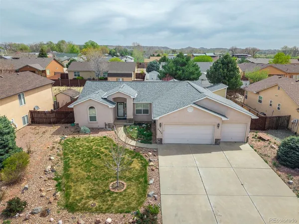 a aerial view of a house with a yard