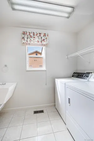 a utility room with closet dryer and washer