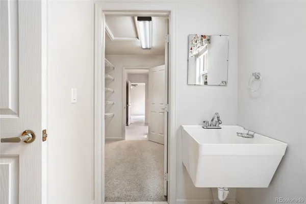 a bathroom with a sink a mirror and shower
