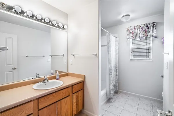 a bathroom with a toilet and a mirror