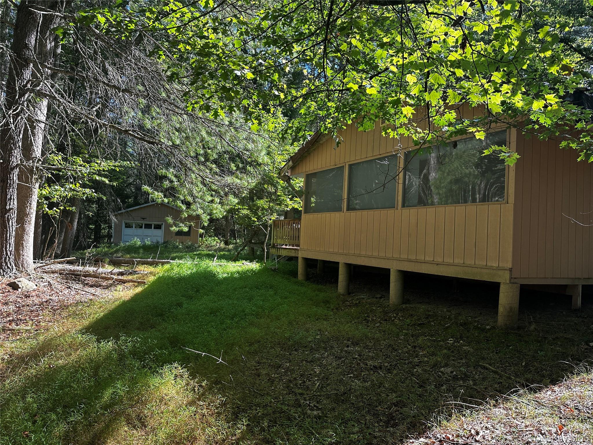 8 Kern Road Barryville, NY 12719 - Photo 5 of 14 a view of a yard with large tree and wooden fence