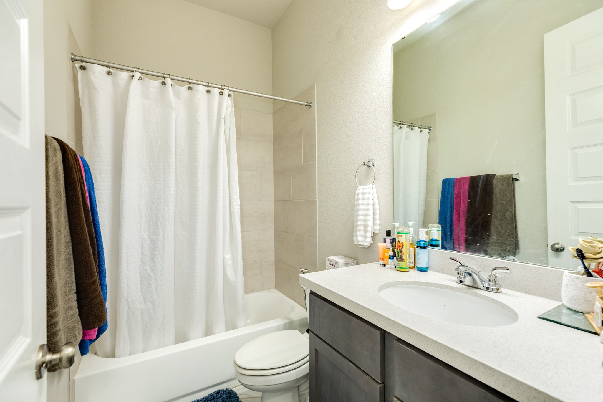 5138 Walnut Grv Lane Manvel, TX 77578 - Photo 31 of 43 a bathroom with a granite countertop sink vanity mirror and toilet