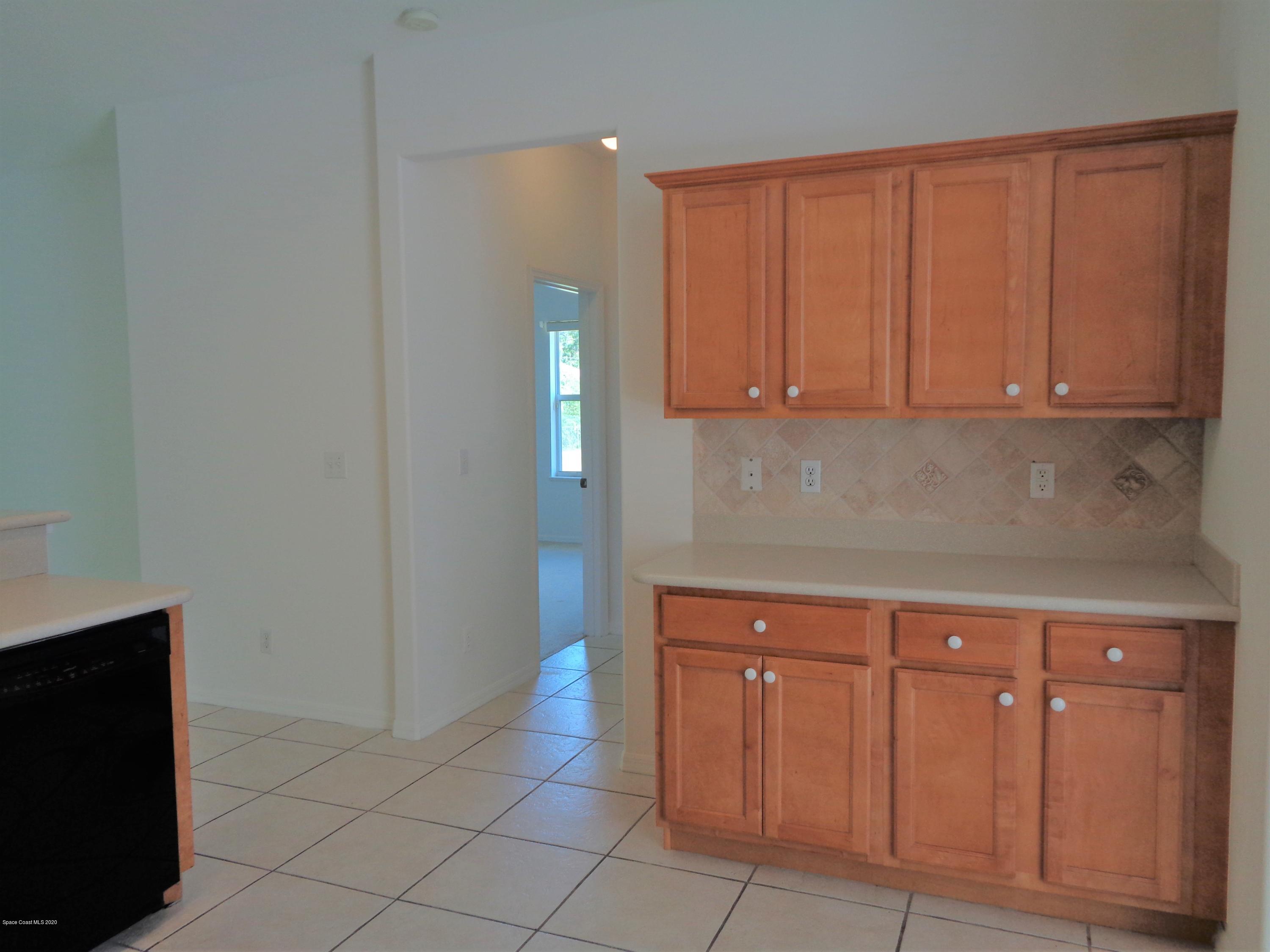 1630 Degroodt Road Southwest Palm Bay, FL 32908 - Photo 16 of 31 Kitchen to Guest Bedrooms/Bath