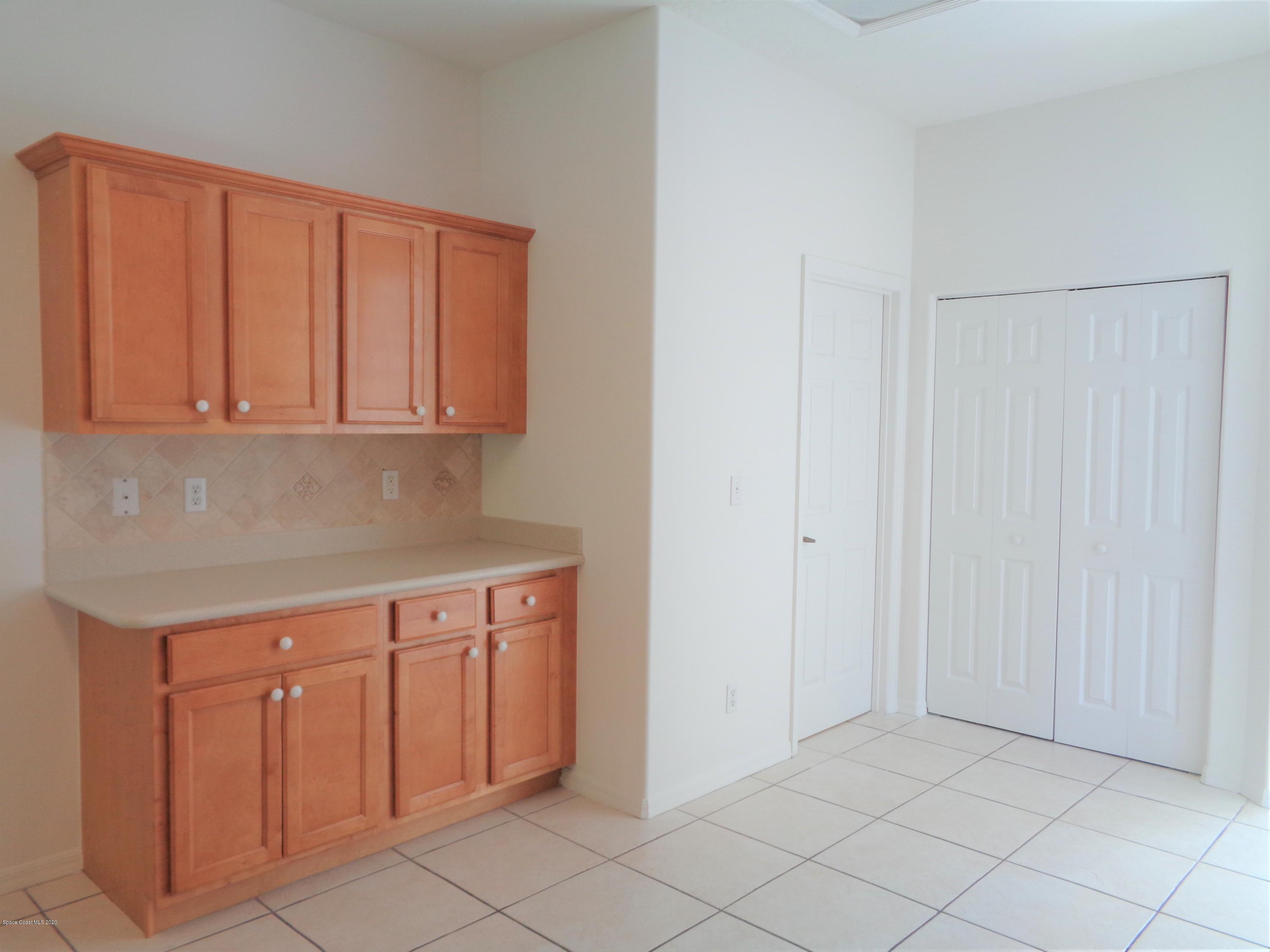 1630 Degroodt Road Southwest Palm Bay, FL 32908 - Photo 17 of 31 Kitchen to Laundry