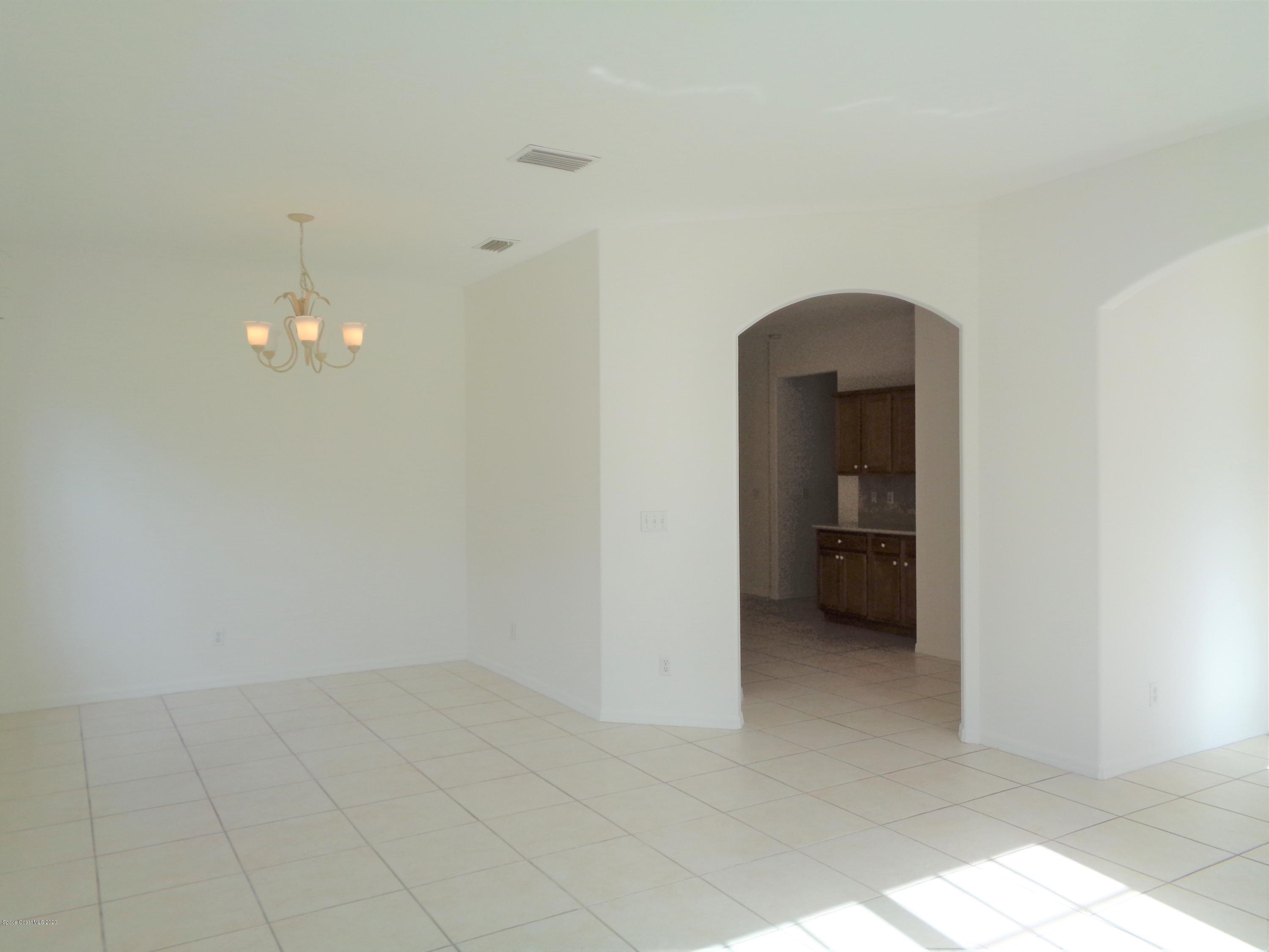 1630 Degroodt Road Southwest Palm Bay, FL 32908 - Photo 4 of 31 Living to Kitchen