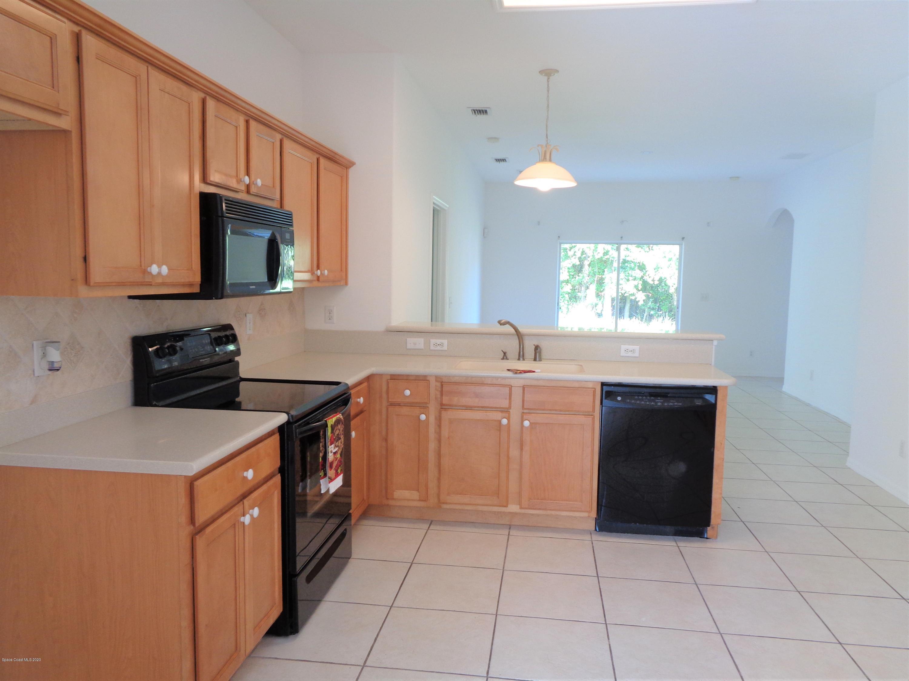 1630 Degroodt Road Southwest Palm Bay, FL 32908 - Photo 9 of 31 Kitchen to Family