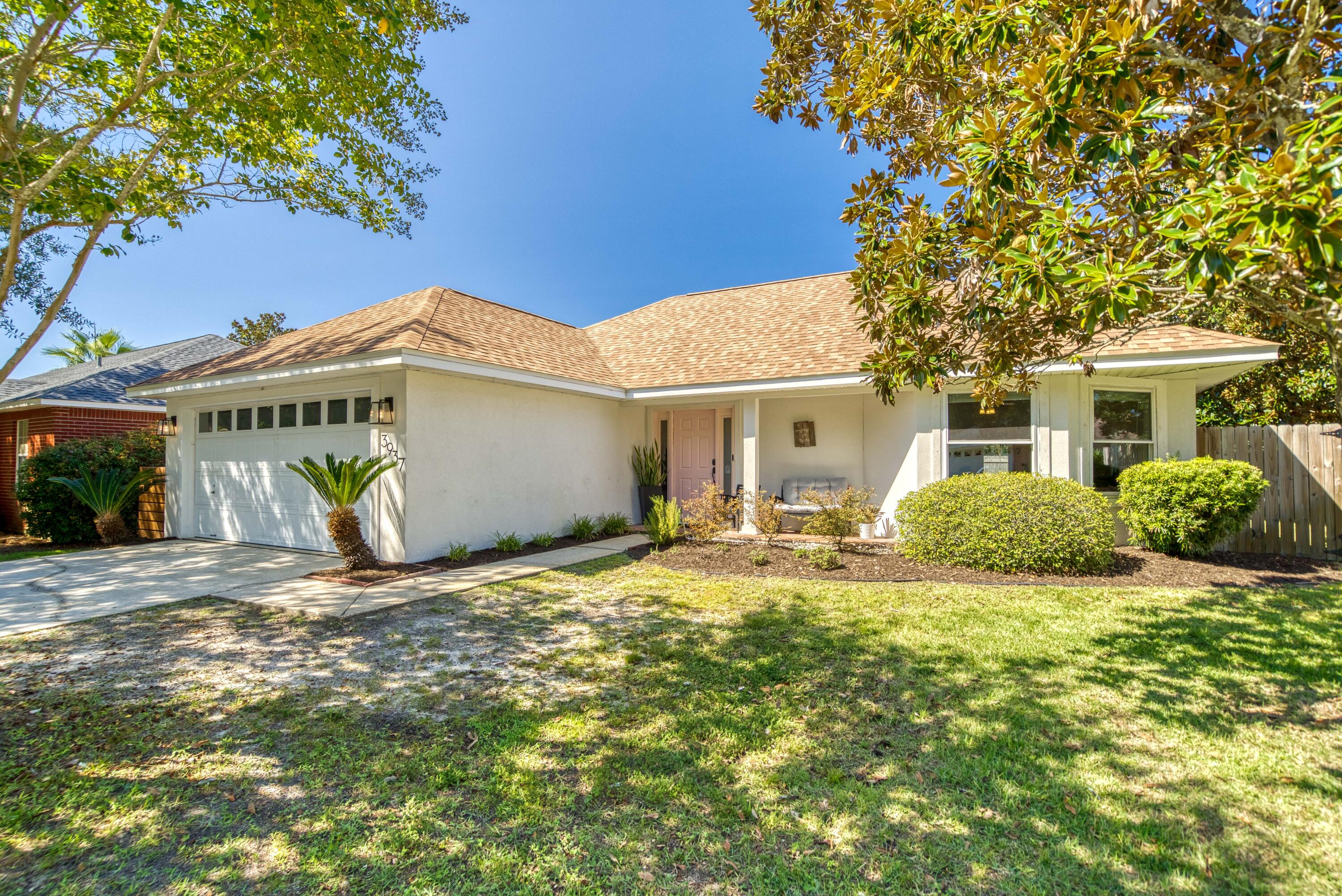 3937 Mesa Road Destin, FL 32541 - Photo 3 of 60 a view of a house with a tree in front of it