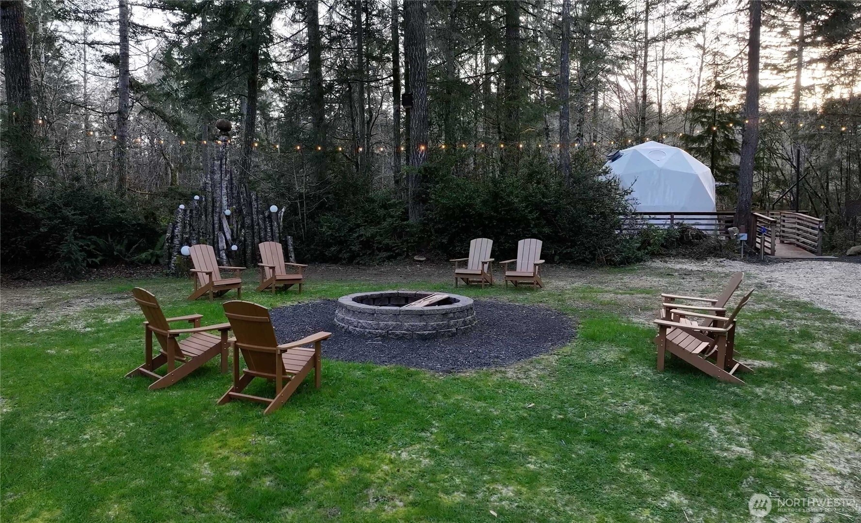 430 Twilight Way Grapeview, WA 98546 - Photo 14 of 22 a backyard of a house with table and chairs