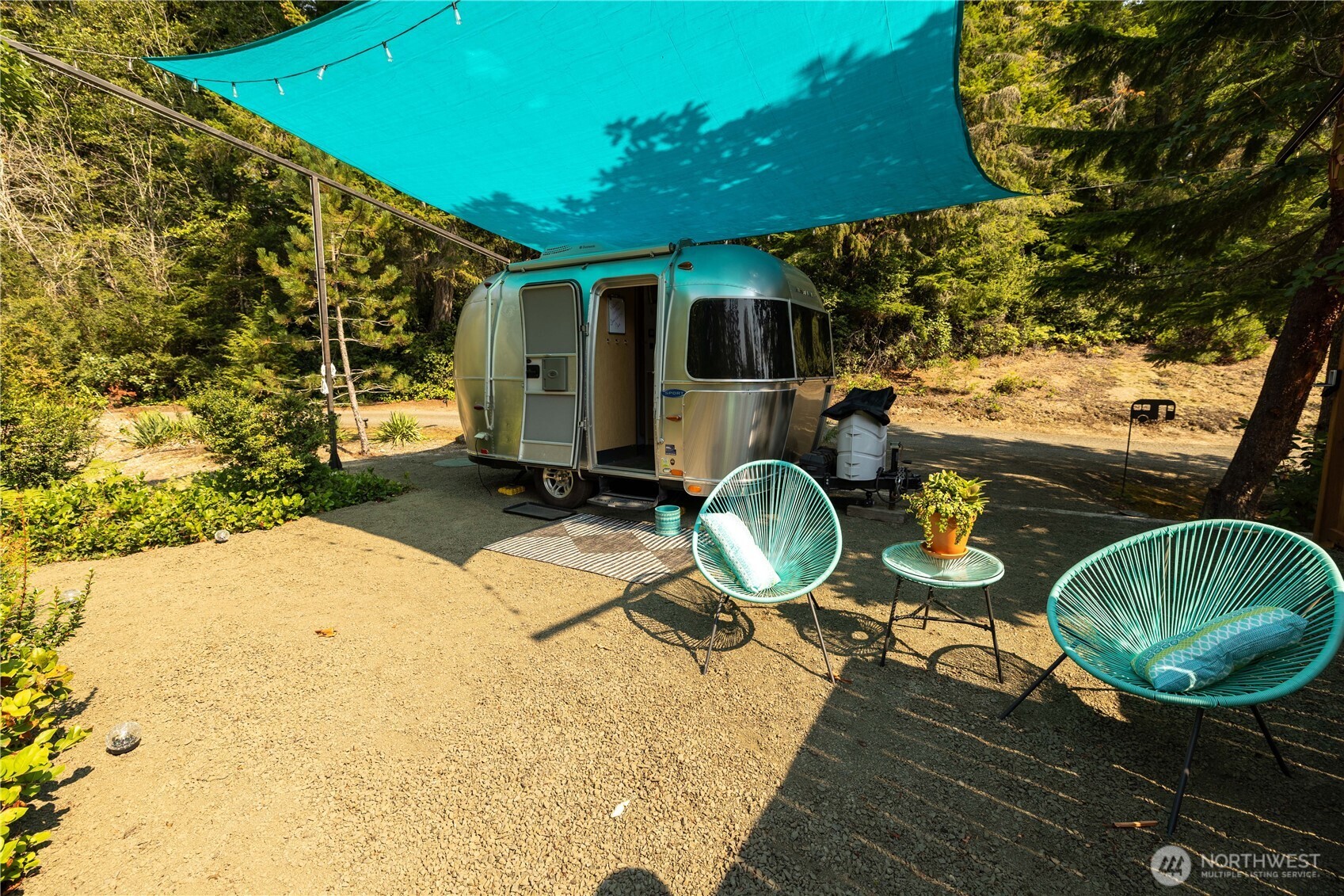 430 Twilight Way Grapeview, WA 98546 - Photo 21 of 22 a backyard of a house with yard and outdoor seating