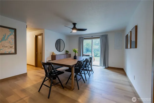 a view of a dining room with furniture window and wooden floor
