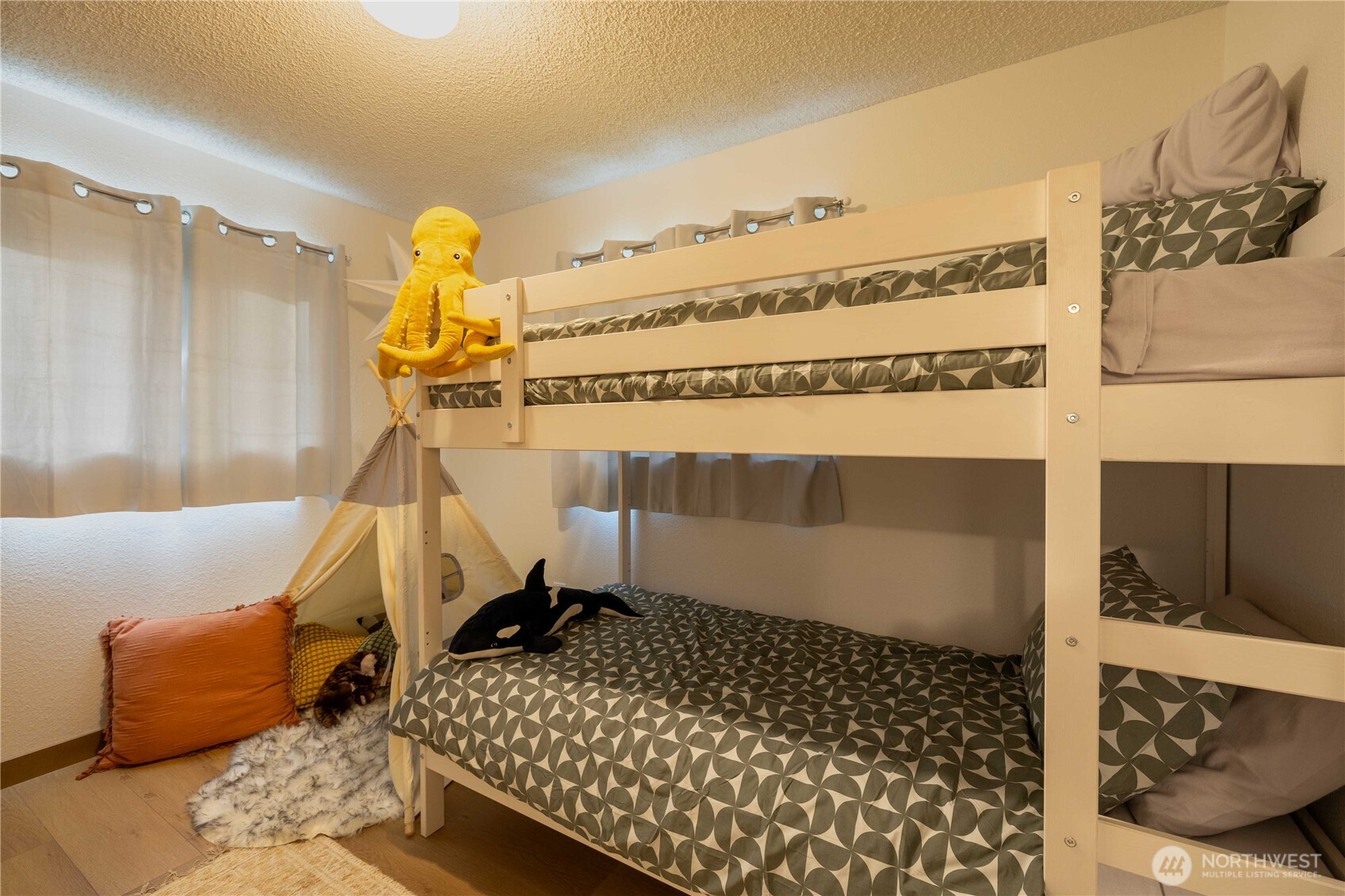 430 Twilight Way Grapeview, WA 98546 - Photo 9 of 22 a bedroom with a bed and the view of en suite bathroom