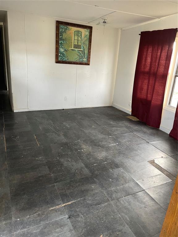 16148 Boca Raton Street Brooksville, FL 34604 - Photo 5 of 7 a view of an empty room and window