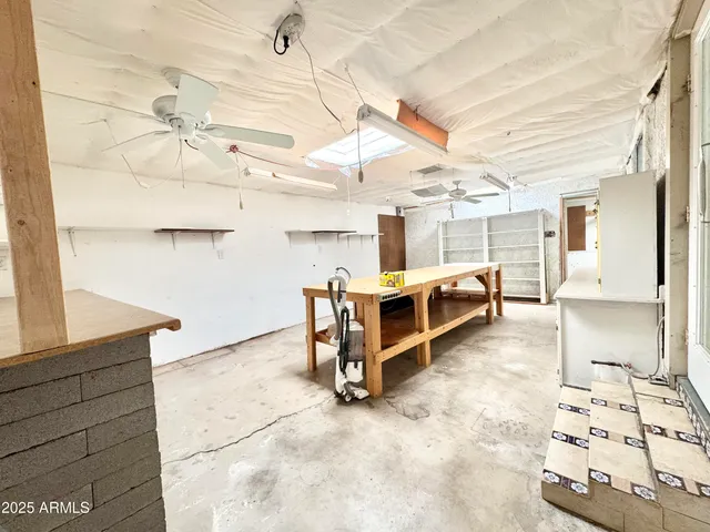 a living room with lots of furniture and a chandelier