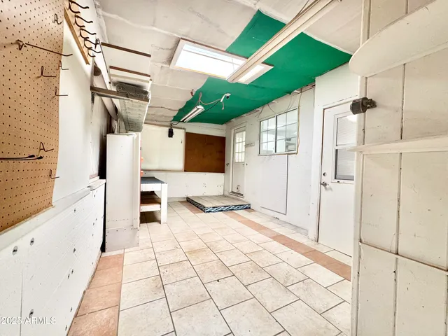 a view of a bathroom with a sink and mirror