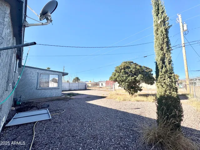 a view of a backyard of the house