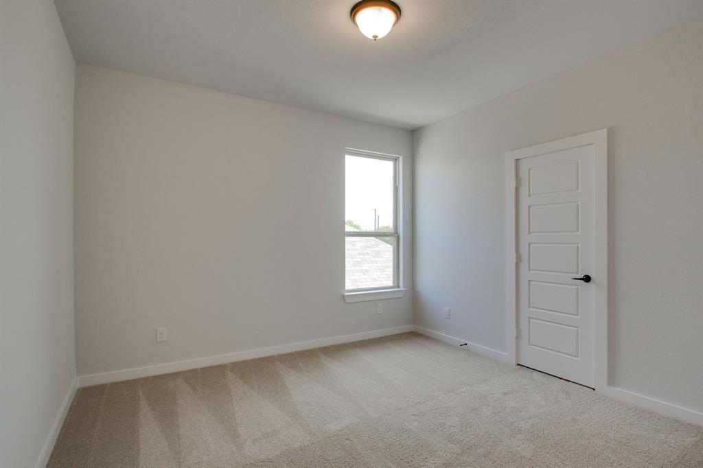 7612 Spring Drive Watauga, TX 76148 - Photo 22 of 40 an empty room with windows